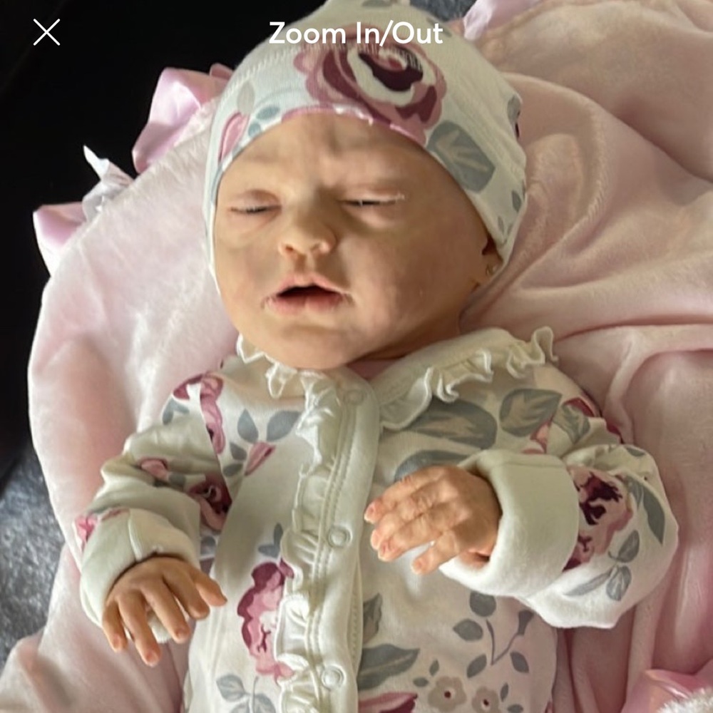 This is a full body silicone drink and wet doll. She does have booboos.